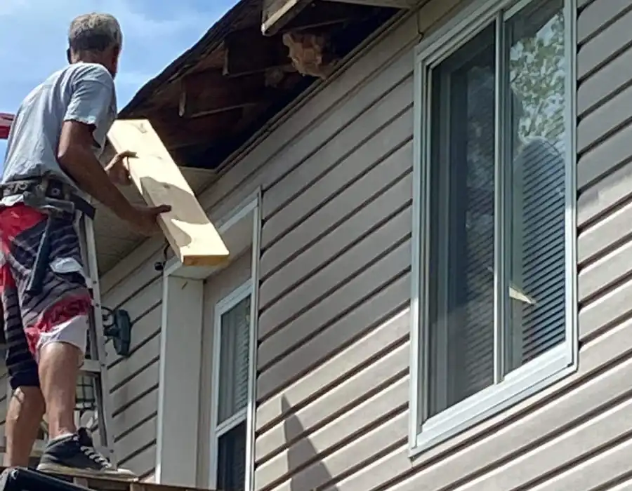 professional eavestrough repair on the roof of a home in Barrie professional eavestrough repair on the roof of a home in Barrie